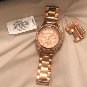 Michael Kors rose gold watch with crystals.